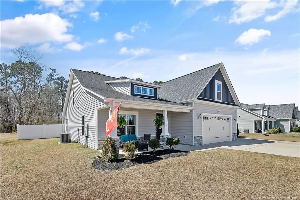 2628 Riddle Farm Road Fayetteville, NC 28306 - Photo 4 of 50 a view of a house with backyard and porch