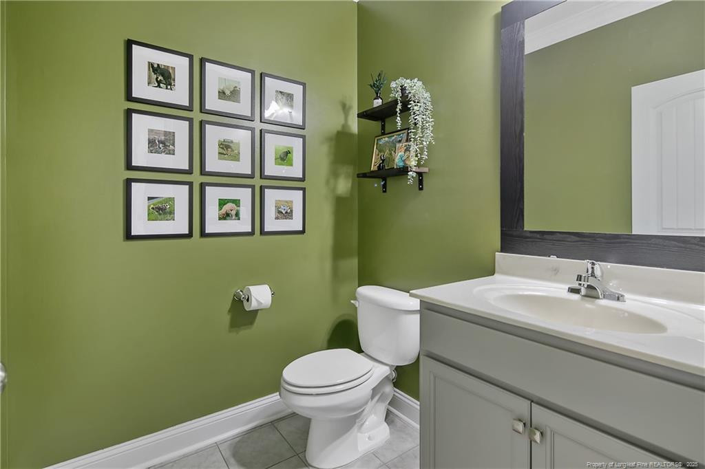 2628 Riddle Farm Road Fayetteville, NC 28306 - Photo 9 of 50 a bathroom with a toilet sink and mirror