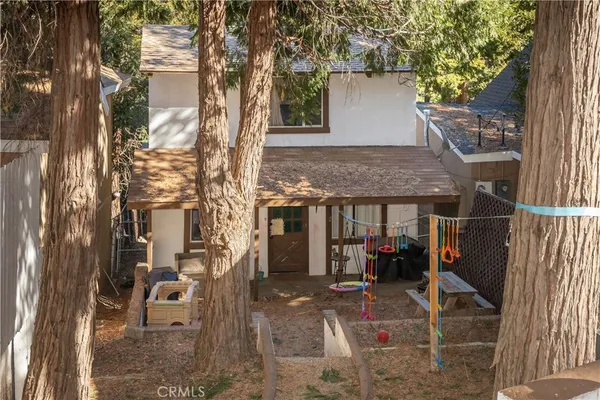 a view of a house with backyard porch and sitting area