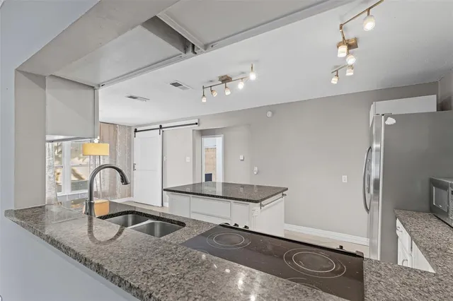 a view of a refrigerator and storage