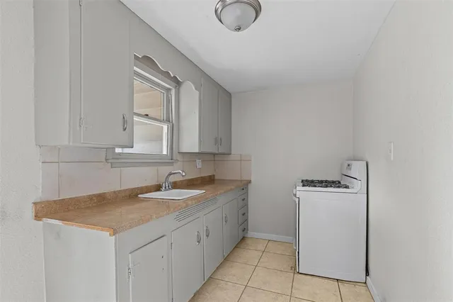 a view of yard with patio