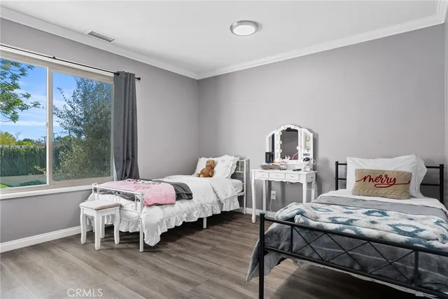 a bedroom with bed and window