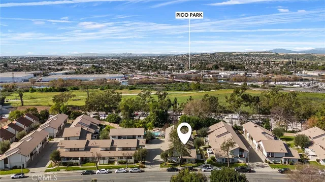 an aerial view of residential building with parking space