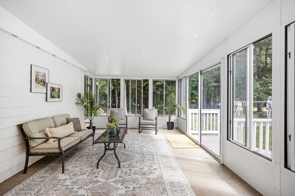 150 High Street Norwell, MA 02061 - Photo 16 of 39 a living room with furniture and large windows