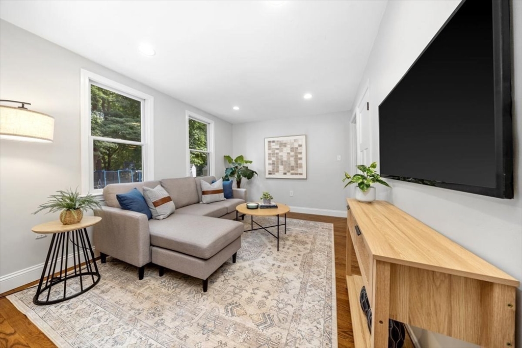 150 High Street Norwell, MA 02061 - Photo 18 of 39 a living room with furniture and a flat screen tv