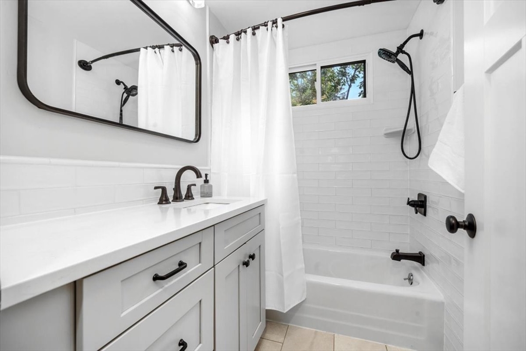 150 High Street Norwell, MA 02061 - Photo 19 of 39 a bathroom with a sink a vanity and a mirror
