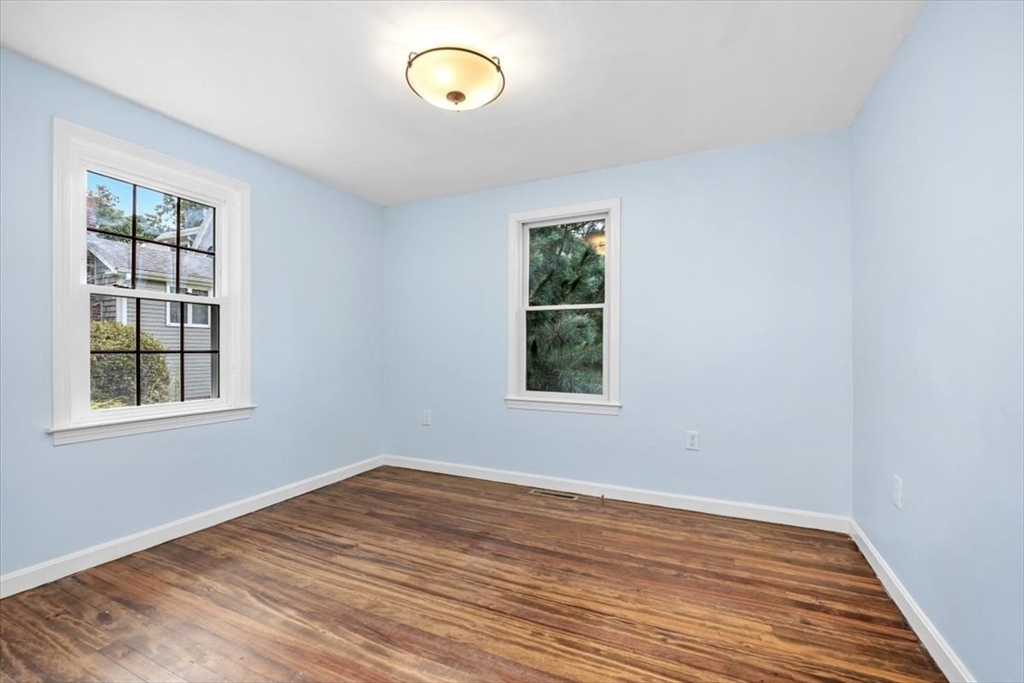 150 High Street Norwell, MA 02061 - Photo 22 of 39 an empty room with wooden floor and windows