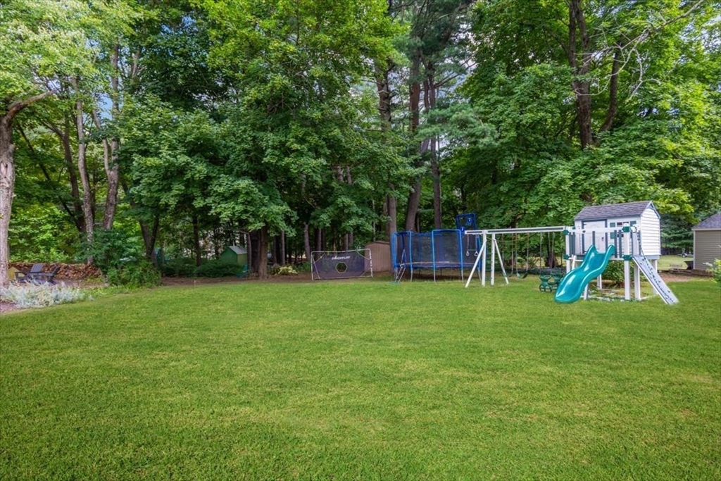 150 High Street Norwell, MA 02061 - Photo 27 of 39 a view of a yard with a slide