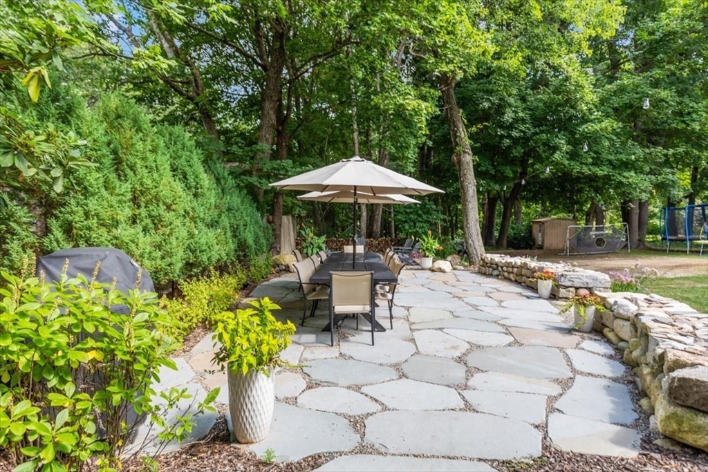 150 High Street Norwell, MA 02061 - Photo 28 of 39 a view of a patio with furniture and a garden