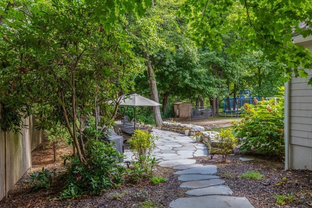 150 High Street Norwell, MA 02061 - Photo 29 of 39 a front view of a house with a garden