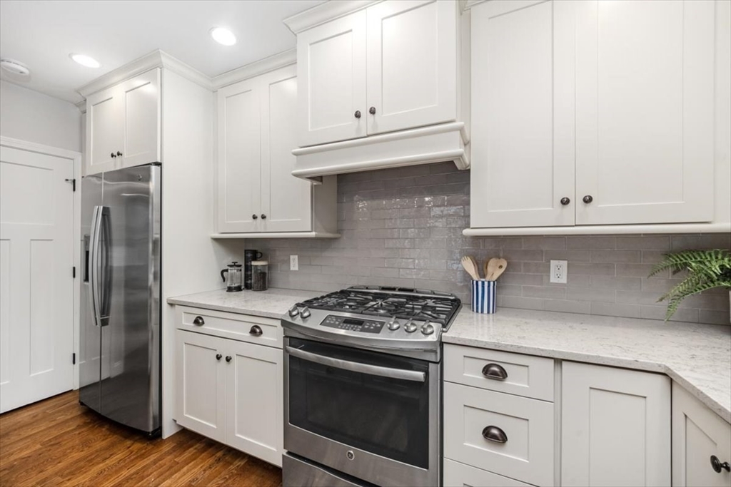 150 High Street Norwell, MA 02061 - Photo 35 of 39 a kitchen with granite countertop white cabinets and stainless steel appliances