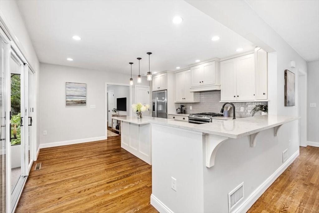 150 High Street Norwell, MA 02061 - Photo 36 of 39 a large white kitchen with lots of counter space a sink appliances and cabinets