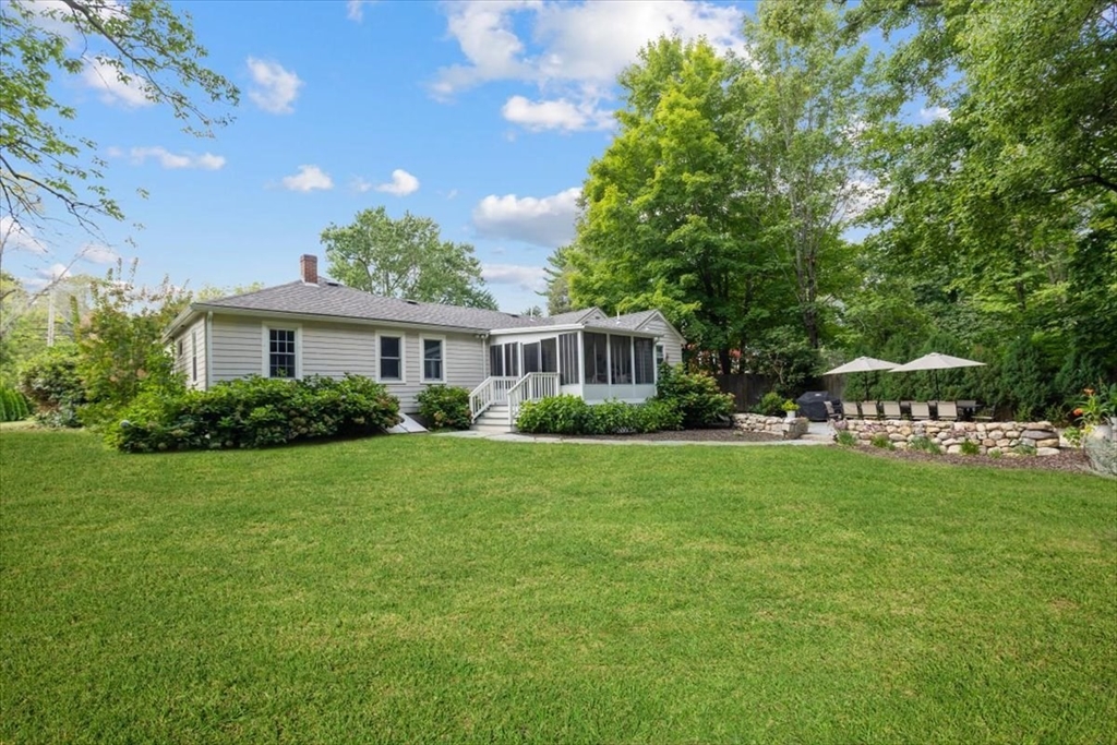 150 High Street Norwell, MA 02061 - Photo 4 of 39 a front view of a house with a garden