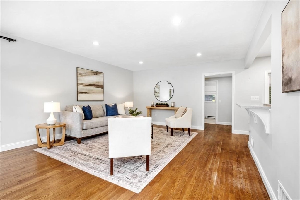 150 High Street Norwell, MA 02061 - Photo 7 of 39 a living room with furniture and a wooden floor