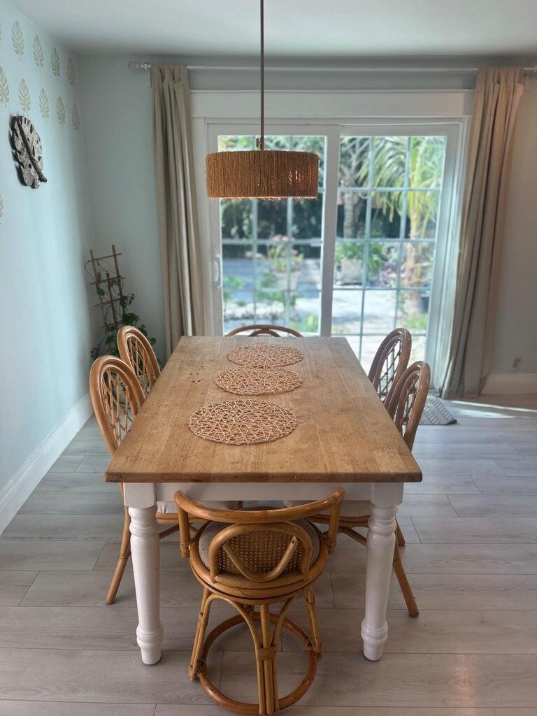 820 30th Street West Palm Beach, FL 33407 - Photo 13 of 40 a view of a dining room with furniture wooden floor and a chandelier