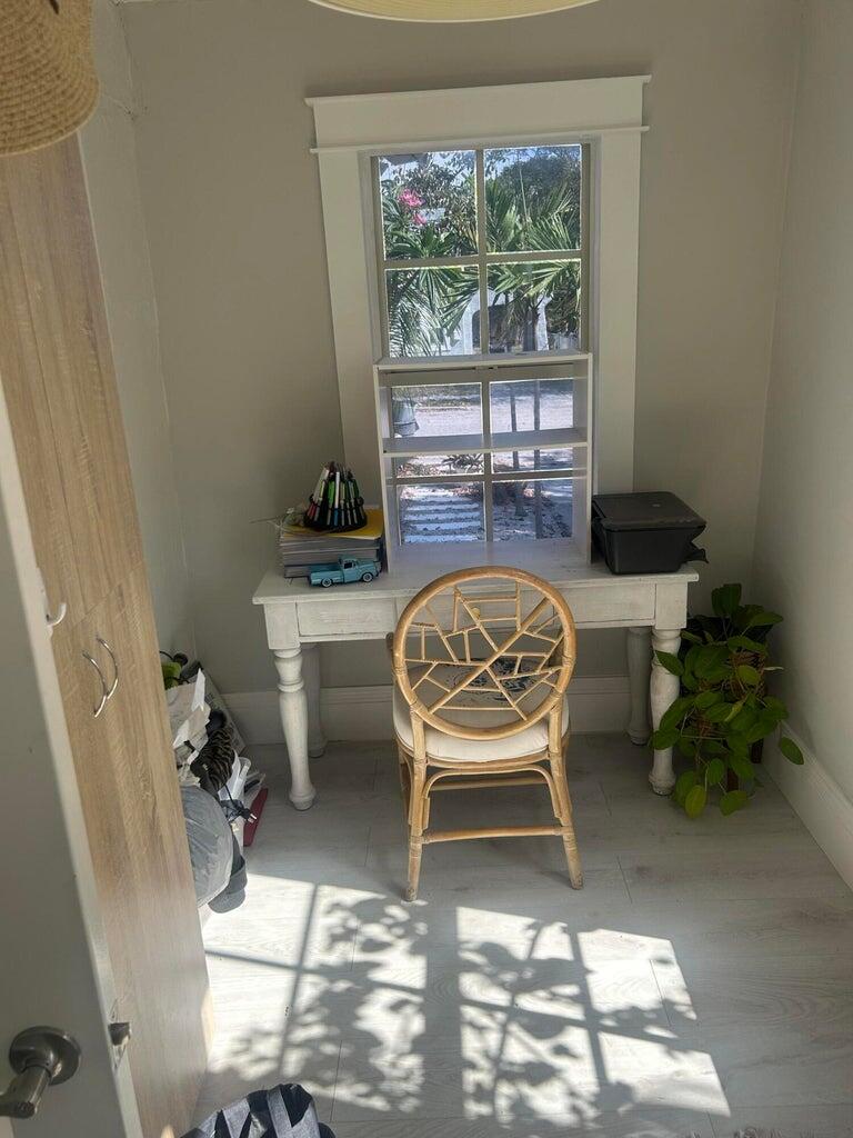 820 30th Street West Palm Beach, FL 33407 - Photo 15 of 40 a dining room with furniture and a floor to ceiling window