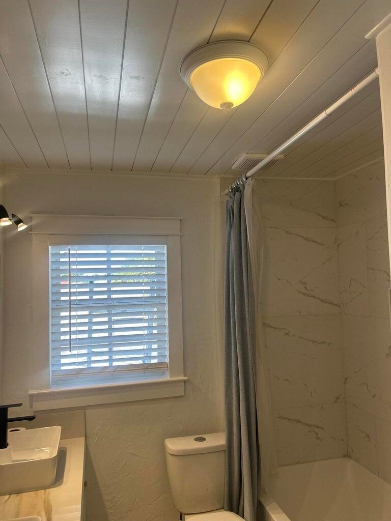 820 30th Street West Palm Beach, FL 33407 - Photo 20 of 40 a bathroom with a sink and a toilet