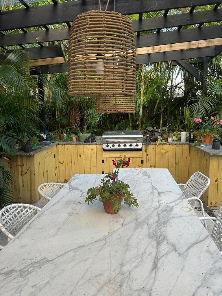 820 30th Street West Palm Beach, FL 33407 - Photo 38 of 40 a view of a swimming pool with a patio