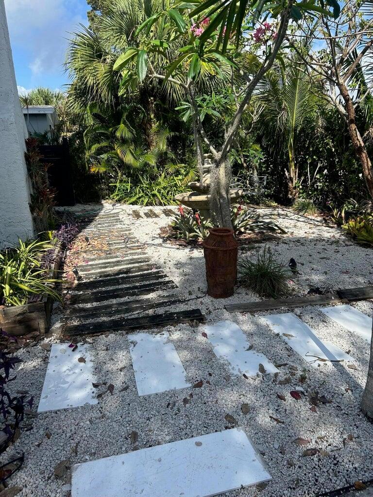 820 30th Street West Palm Beach, FL 33407 - Photo 4 of 40 a view of a yard with chairs
