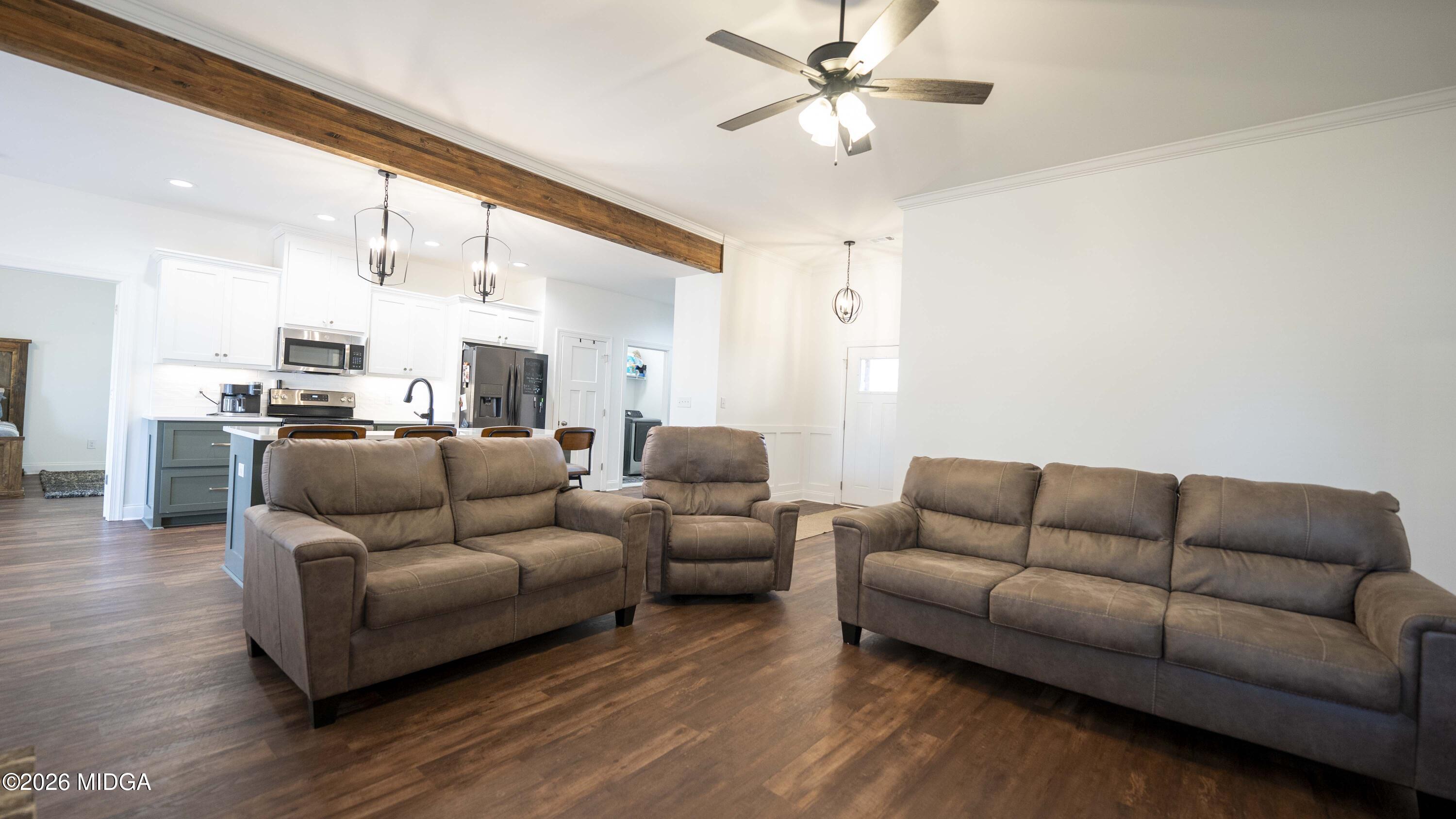 106 Raspberry Trail Perry, GA 31069 - Photo 12 of 42 a living room with furniture kitchen view and a chandelier