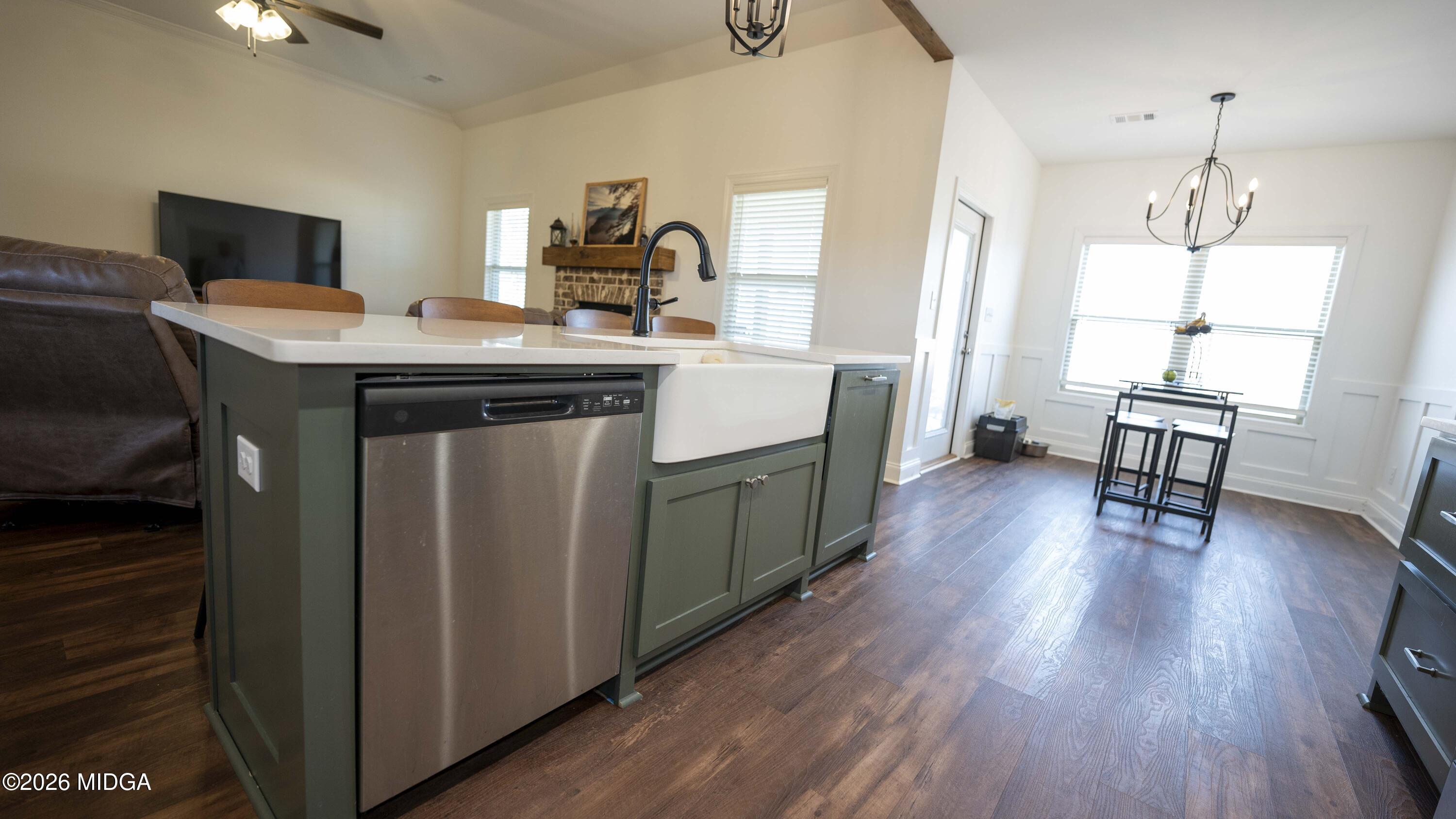 106 Raspberry Trail Perry, GA 31069 - Photo 16 of 42 a kitchen with a sink stove and wooden floor