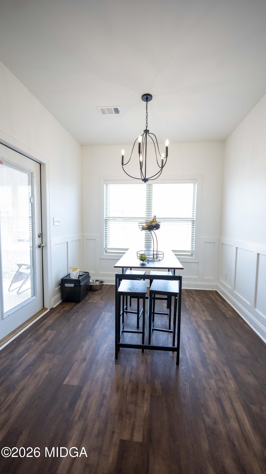 106 Raspberry Trail Perry, GA 31069 - Photo 18 of 42 a view of a livingroom with furniture window and wooden floor
