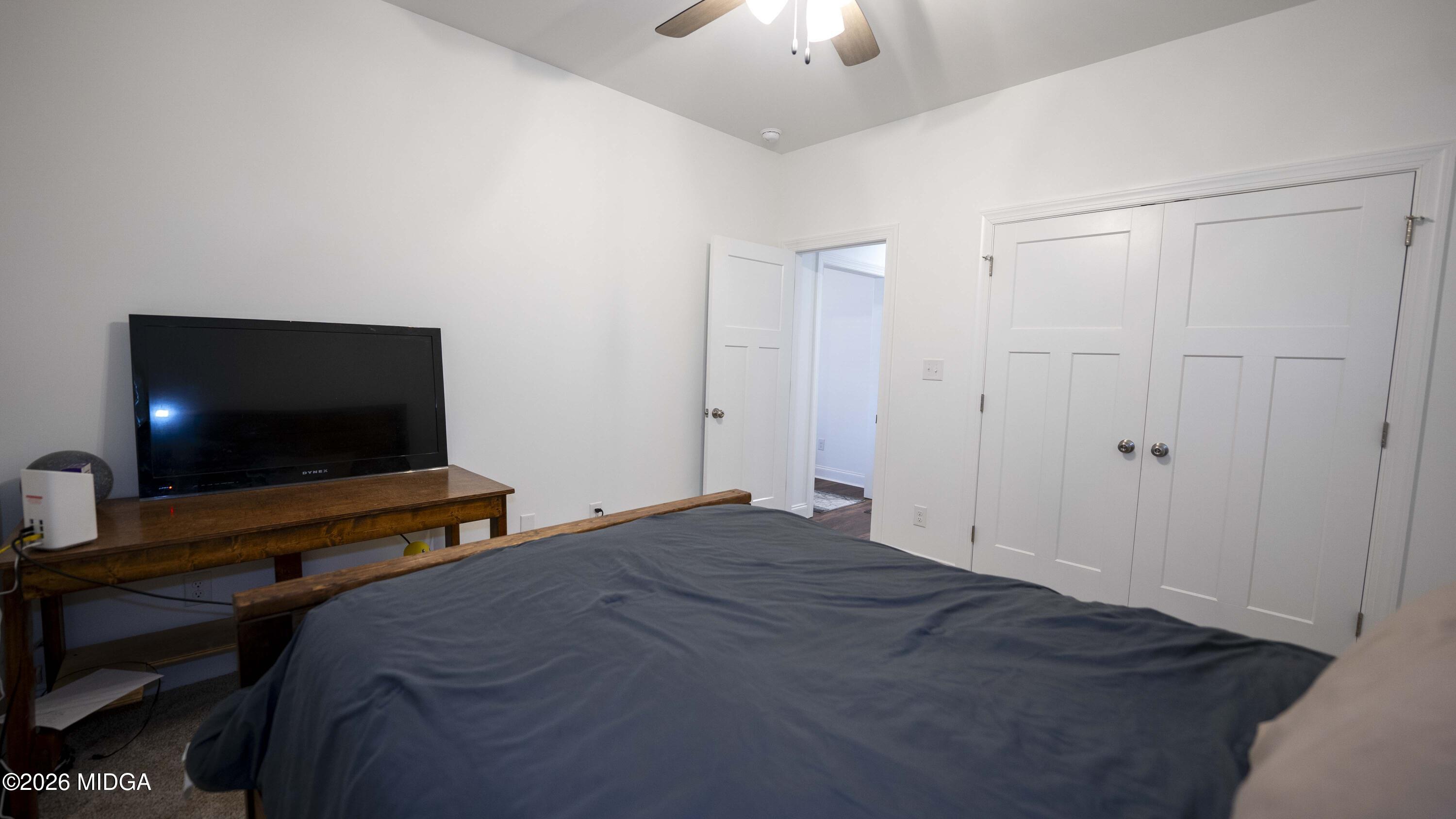 106 Raspberry Trail Perry, GA 31069 - Photo 30 of 42 a bedroom with a bed and a flat screen tv