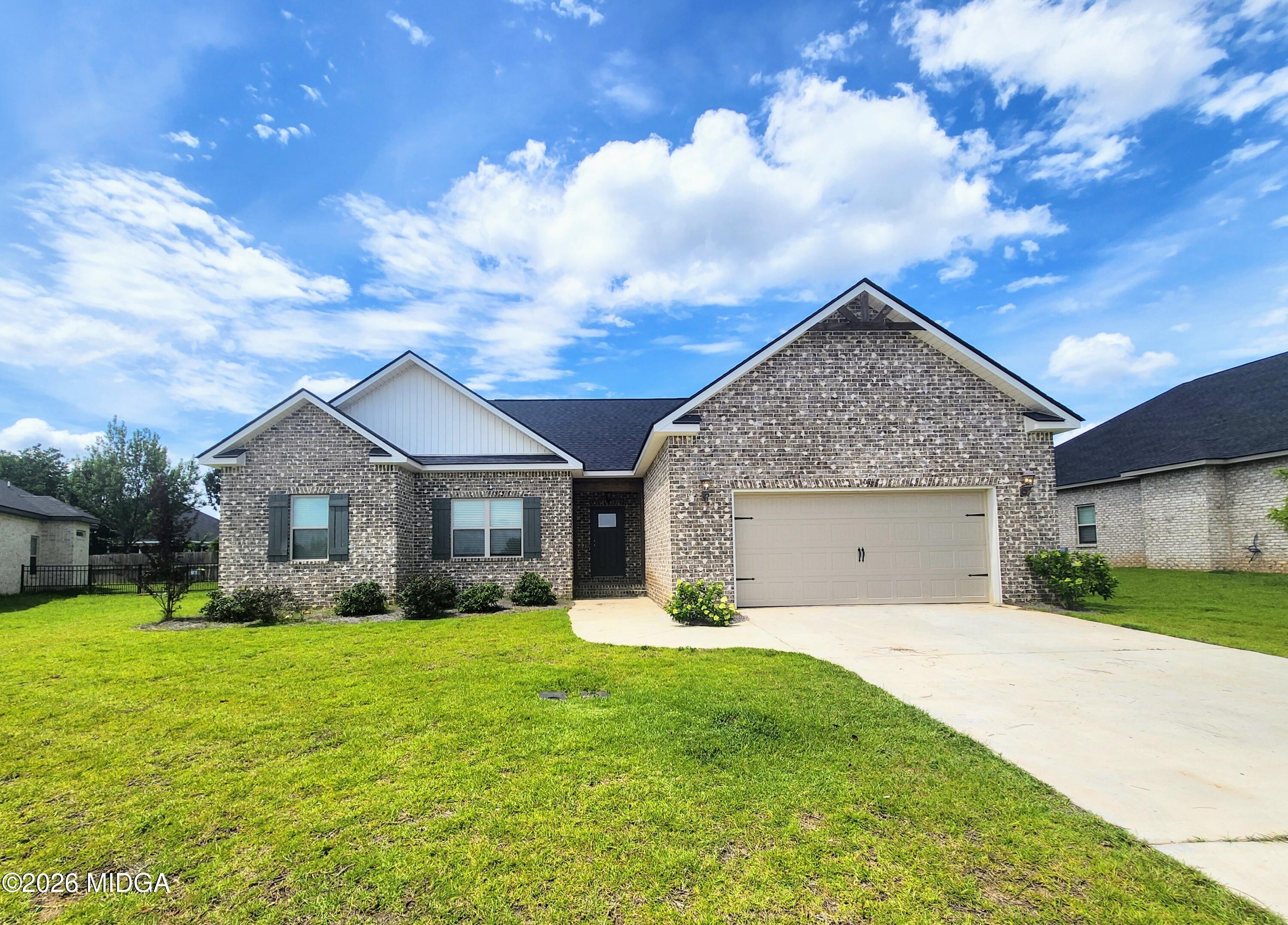 106 Raspberry Trail Perry, GA 31069 - Photo 3 of 42 a front view of house with yard and green space