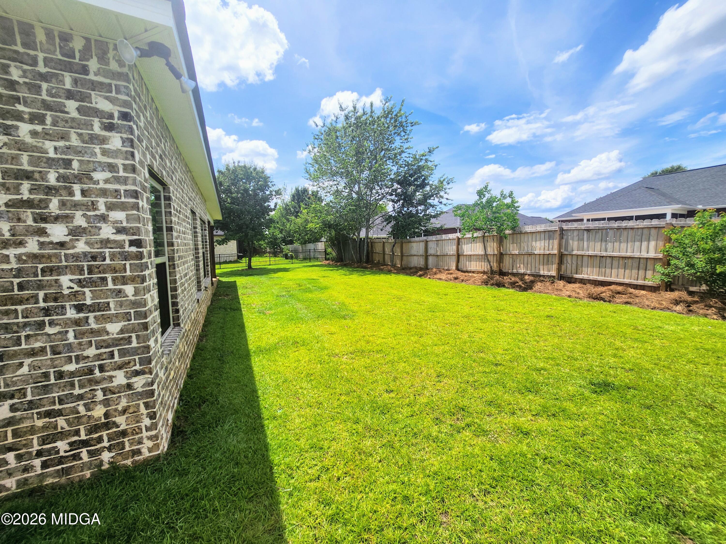 106 Raspberry Trail Perry, GA 31069 - Photo 36 of 42 a swimming pool with outdoor seating and yard