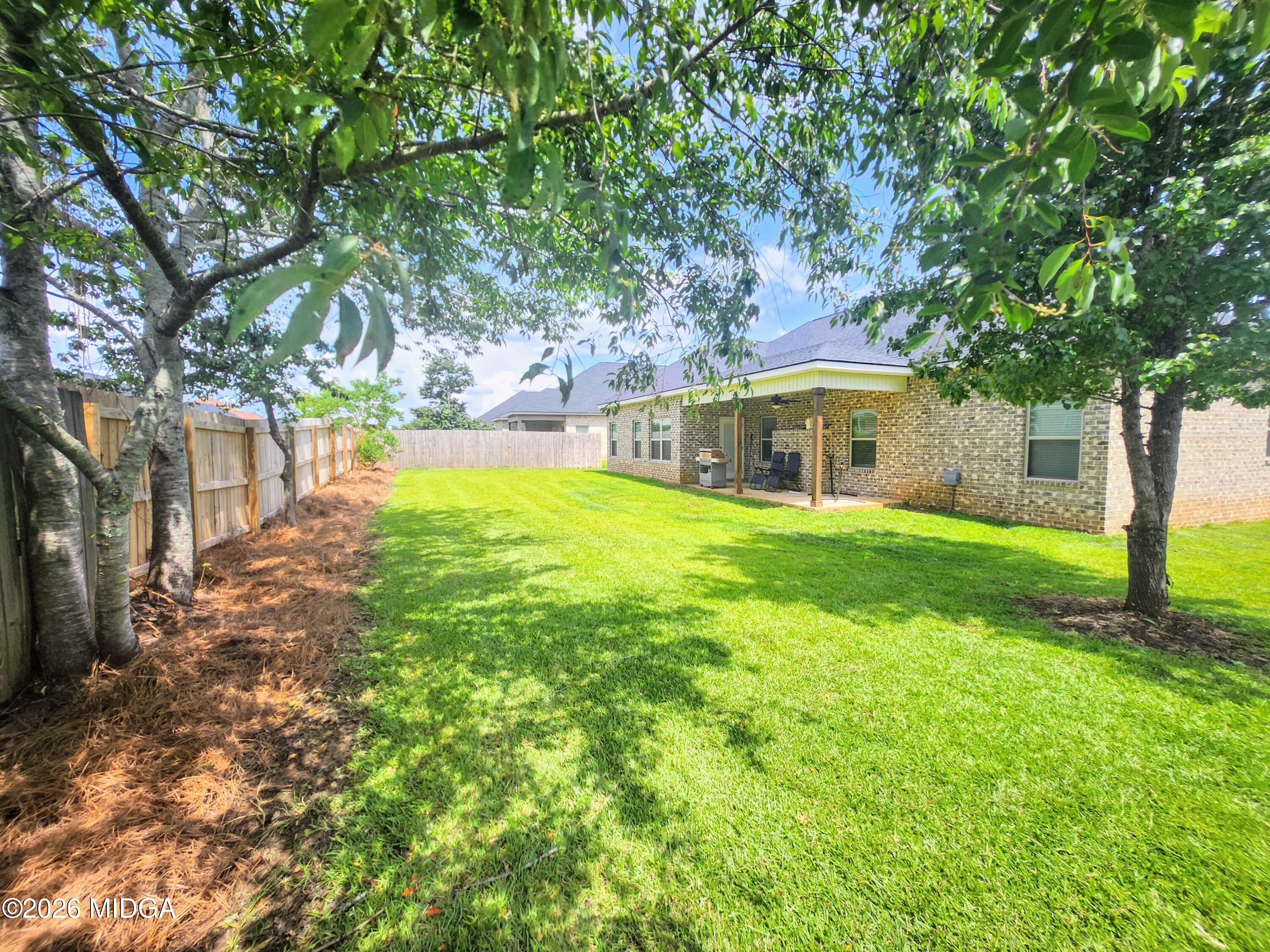 106 Raspberry Trail Perry, GA 31069 - Photo 41 of 42 a view of a house with a yard porch and sitting area