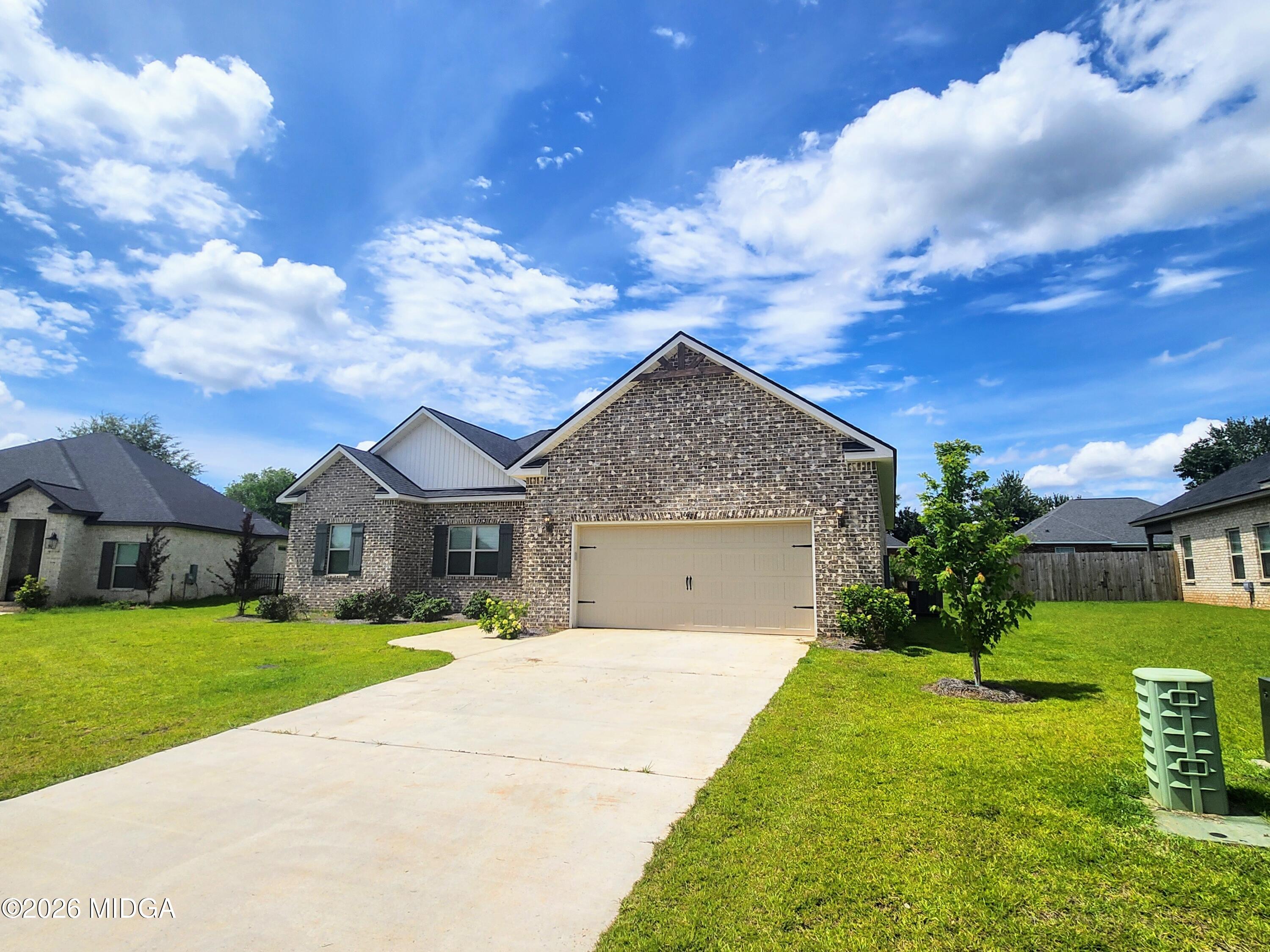 106 Raspberry Trail Perry, GA 31069 - Photo 5 of 42 a front view of a house with garden
