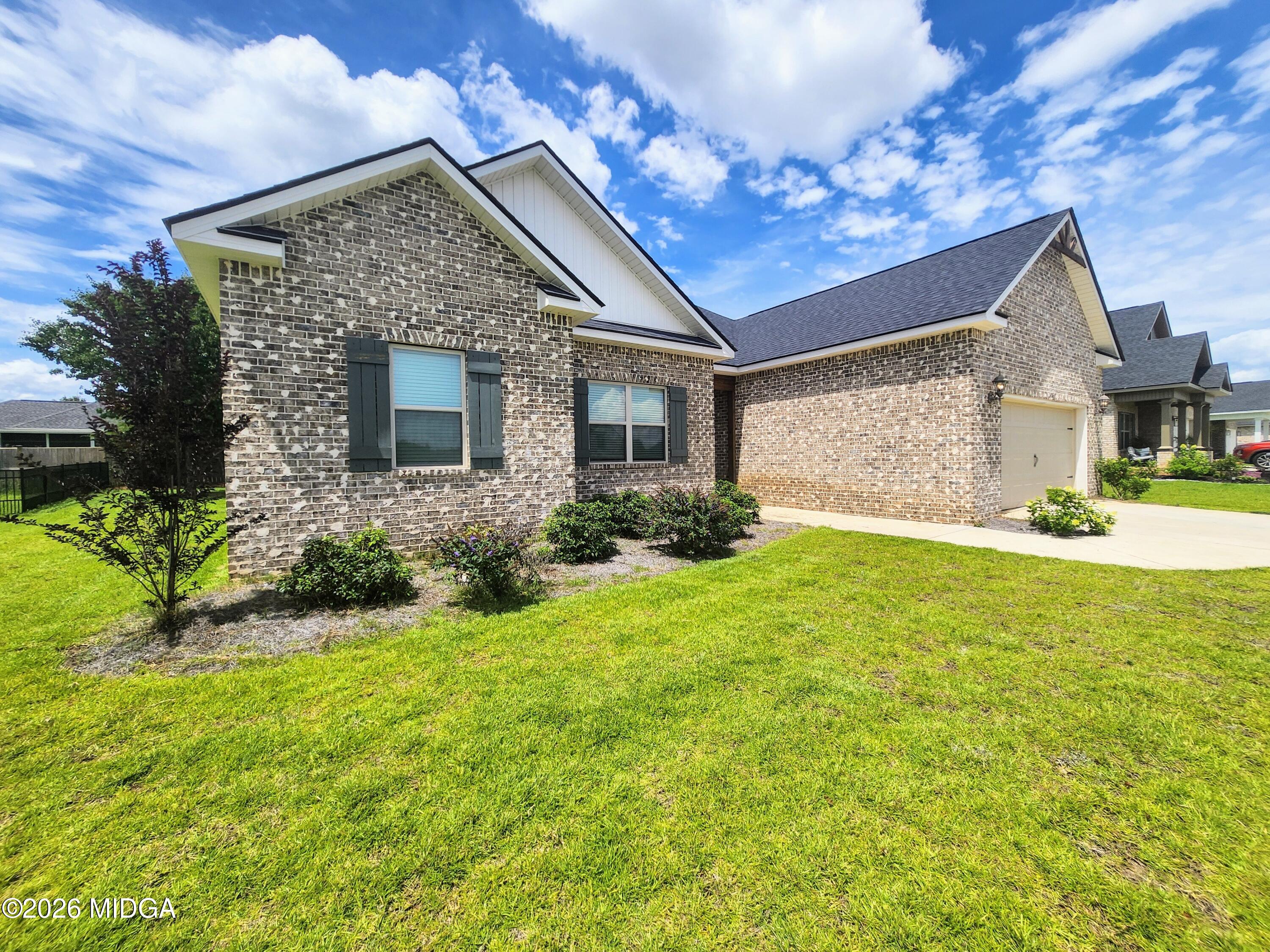 106 Raspberry Trail Perry, GA 31069 - Photo 6 of 42 a front view of a house with garden