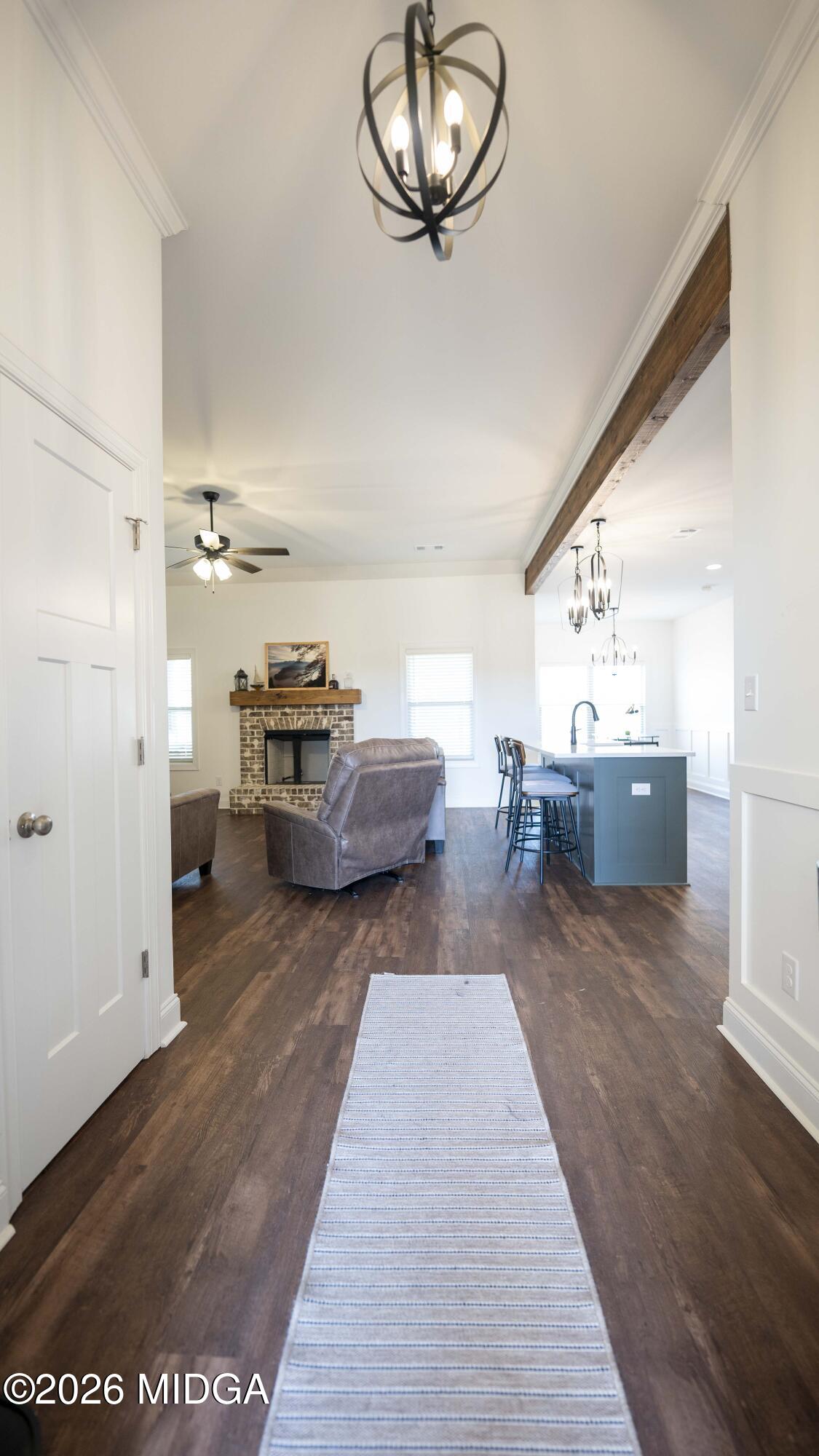 106 Raspberry Trail Perry, GA 31069 - Photo 8 of 42 a living room with furniture and a chandelier