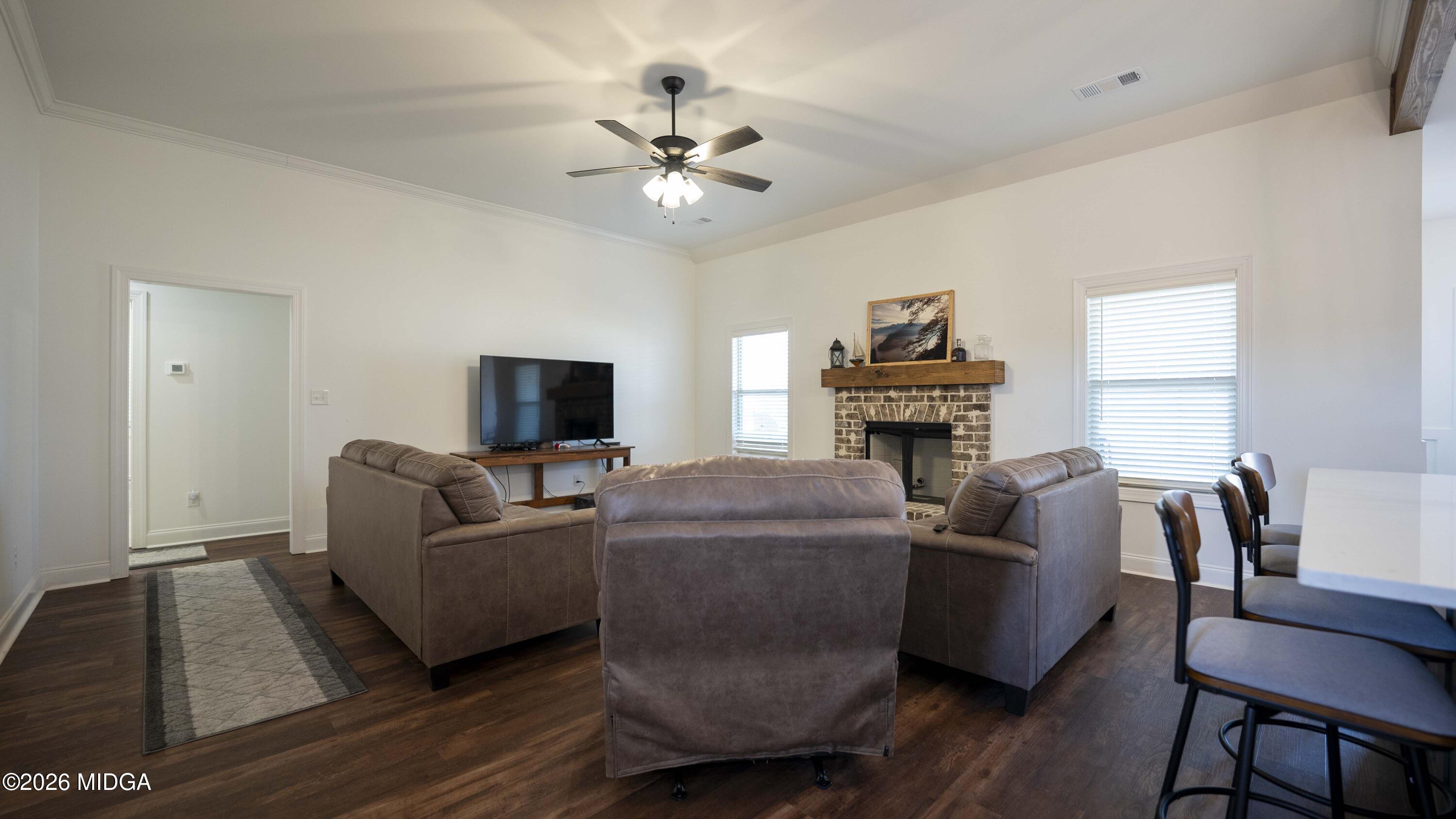 106 Raspberry Trail Perry, GA 31069 - Photo 10 of 42 a living room with furniture and a fireplace