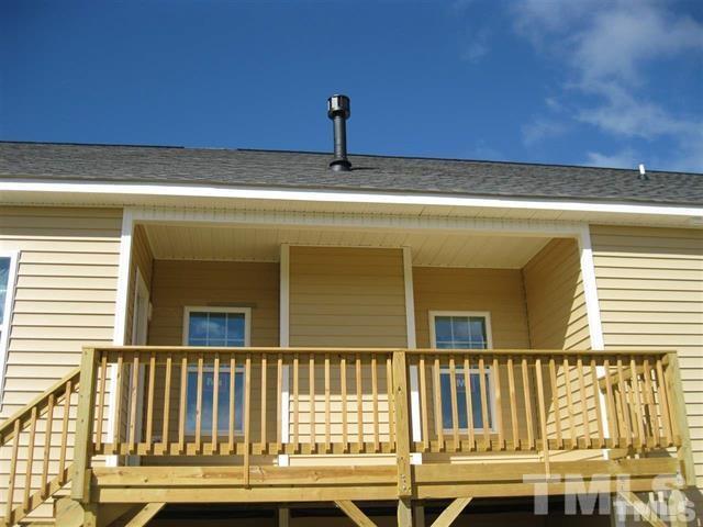 10894 Selma Road Middlesex, NC 27557 - Photo 12 of 12 a view of a brick house with a small yard