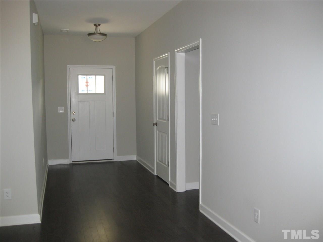 10894 Selma Road Middlesex, NC 27557 - Photo 3 of 12 wooden floor in a hall with a window