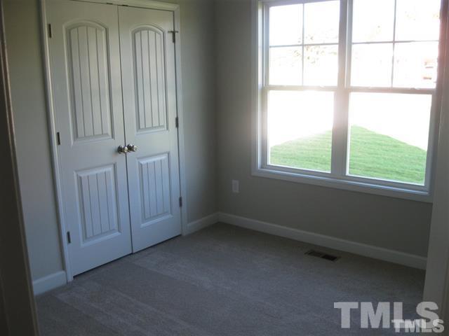 10894 Selma Road Middlesex, NC 27557 - Photo 10 of 12 an empty room with a window
