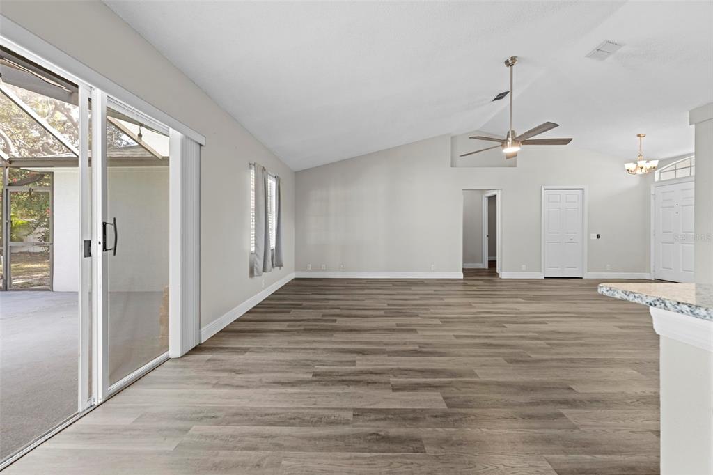 8155 Giffen Lane Spring Hill, FL 34608 - Photo 13 of 52 a view of a room with wooden floor