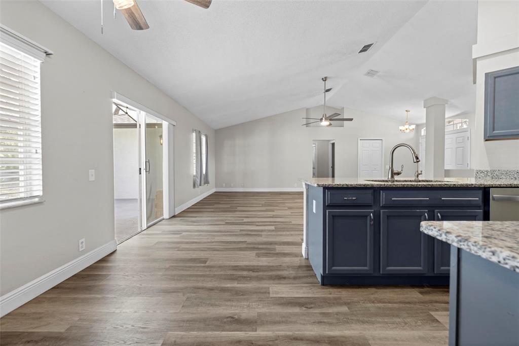8155 Giffen Lane Spring Hill, FL 34608 - Photo 19 of 52 a kitchen with a sink and wooden floor