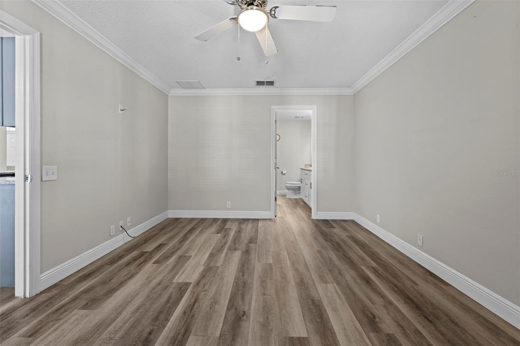 8155 Giffen Lane Spring Hill, FL 34608 - Photo 24 of 52 wooden floor in an empty room with a window