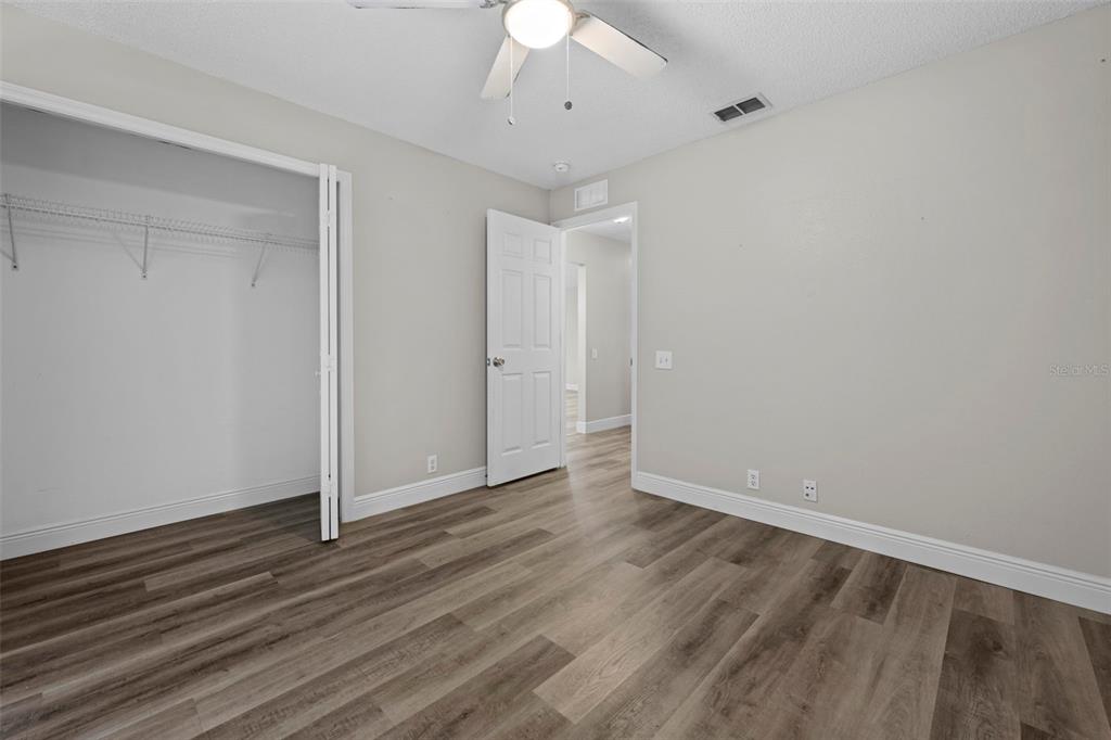 8155 Giffen Lane Spring Hill, FL 34608 - Photo 26 of 52 a view of an empty room with wooden floor