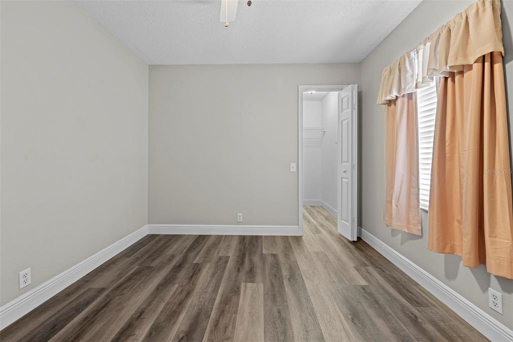 8155 Giffen Lane Spring Hill, FL 34608 - Photo 31 of 52 a view of a room with wooden floor and a window
