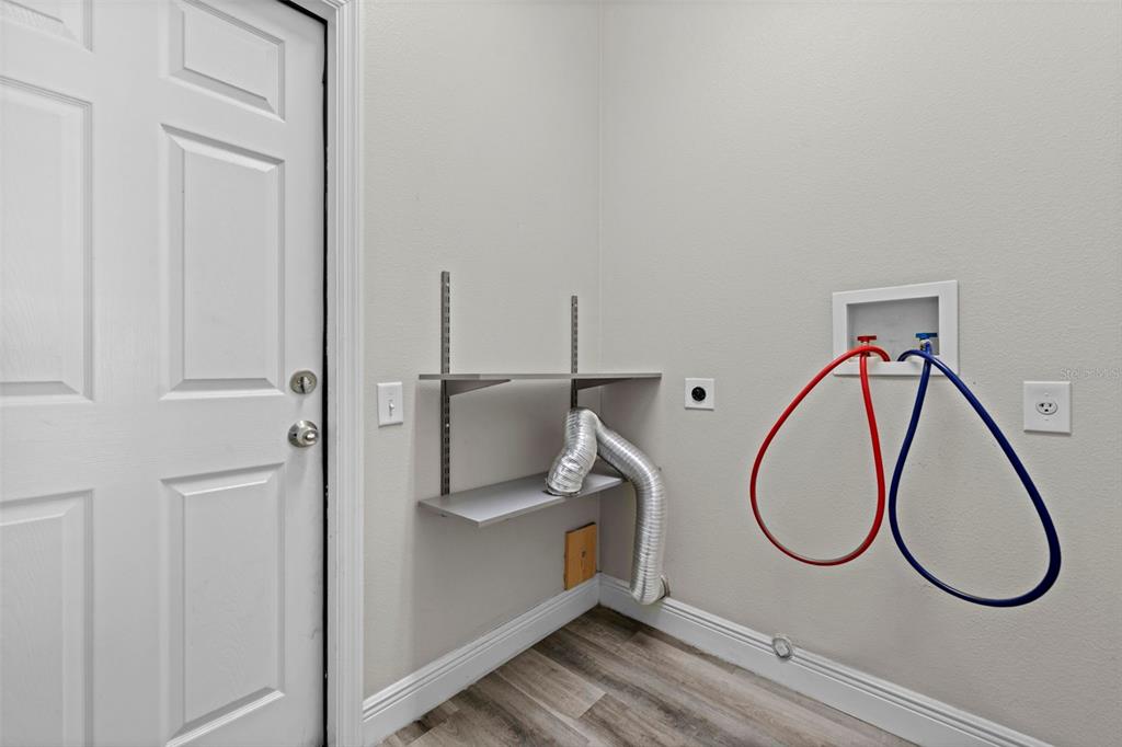 8155 Giffen Lane Spring Hill, FL 34608 - Photo 36 of 52 a view of an entryway with wooden floor
