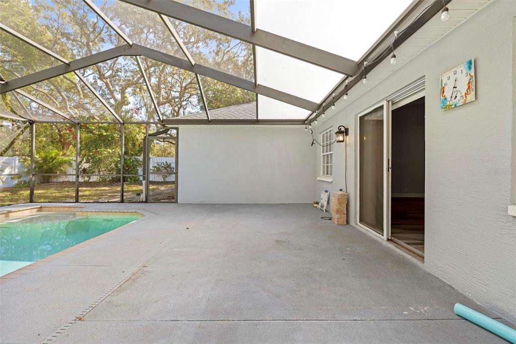 8155 Giffen Lane Spring Hill, FL 34608 - Photo 40 of 52 a view of a house with a yard and garage