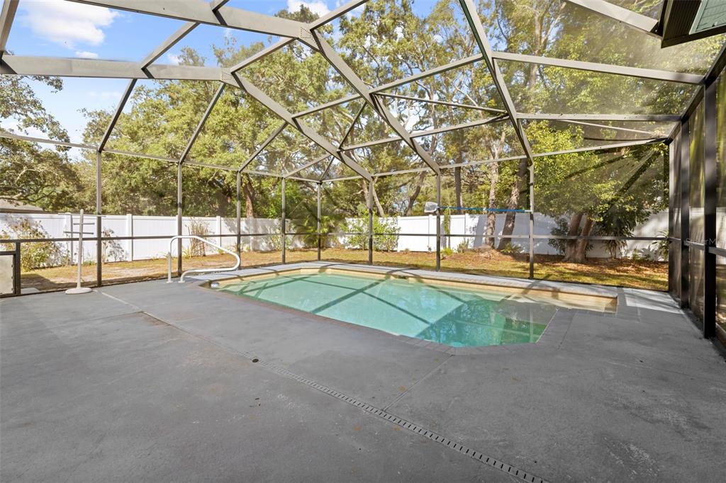 8155 Giffen Lane Spring Hill, FL 34608 - Photo 41 of 52 a view of outdoor space with a flat tv screen and a small yard