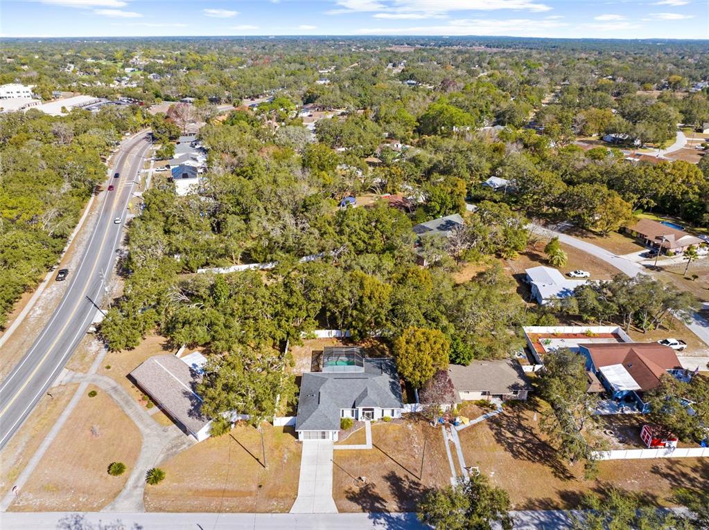 8155 Giffen Lane Spring Hill, FL 34608 - Photo 46 of 52 an aerial view of residential houses with outdoor space
