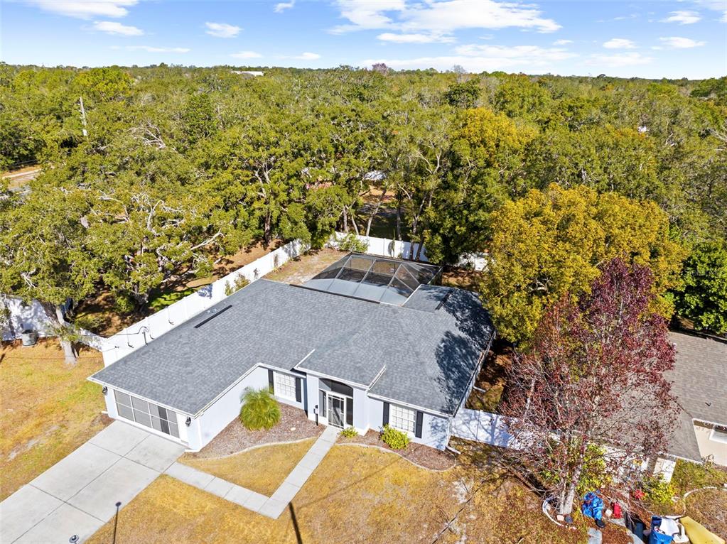 8155 Giffen Lane Spring Hill, FL 34608 - Photo 51 of 52 a view of a house with a yard