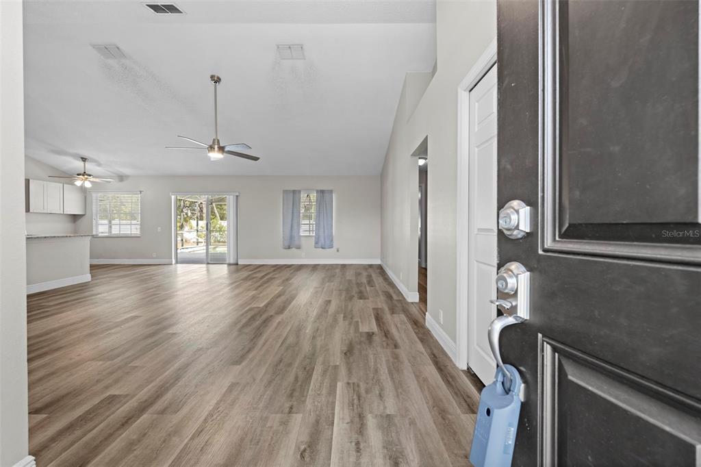 8155 Giffen Lane Spring Hill, FL 34608 - Photo 7 of 52 a view of empty room with wooden floor