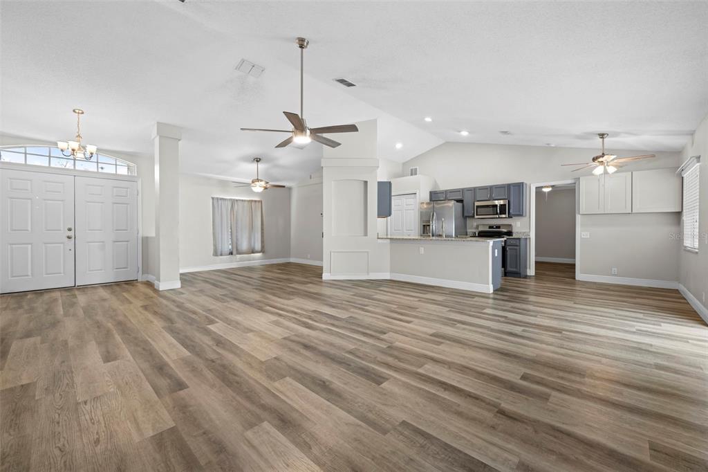 8155 Giffen Lane Spring Hill, FL 34608 - Photo 10 of 52 a view of a kitchen with a sink and a refrigerator