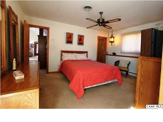 2525 Ridge Road Charlottesville, VA 22901 - Photo 31 of 33 a bedroom with a bed and a flat screen tv
